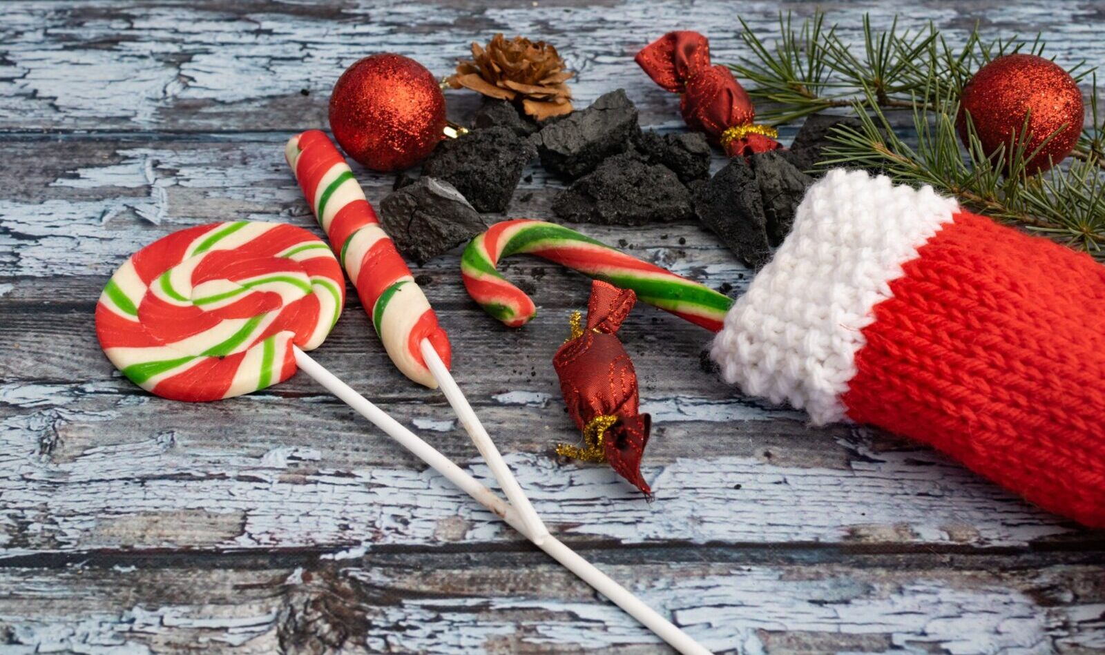 Composition with sweet coals, stockings and candies from la Befana